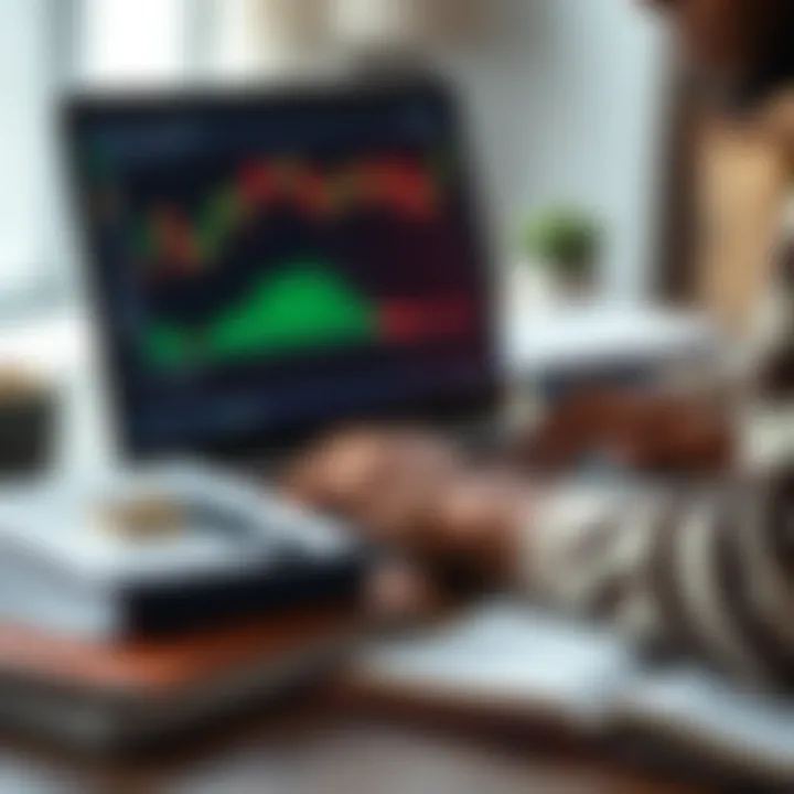 Combining Reading and Practical Tools for Forex Trading Success Close-up of a person studying forex market charts on a laptop with books and notes nearby
